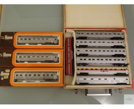 HO GAUGE - GROUP OF LIMA AUSTRALIAN OUTLINE ROLLING STOCK to include a DIESEL LOCO and 6 coaches in a wooden carrying case, t