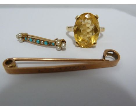 An 18ct yellow gold dress ring claw set with an oval facetted yellow stone, probably a citrine, within a crown decorated with