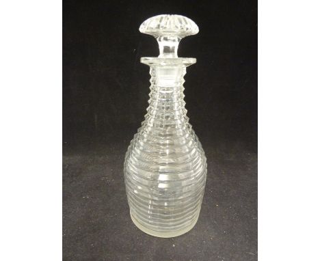 A step cut glass decanter, with mushroom stopper cut with a starburst above an octagonal rim, c1820, 23.5cm 
