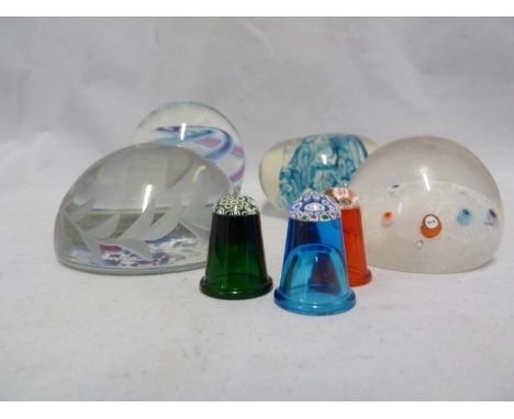 Three Caithness glass paperweight cane thimbles, orange, emerald green and blue bodies; a commemorative paperweight for Eliza