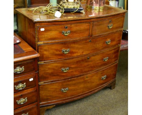 A mahogany bow front four height chest of drawers on bracket feet 