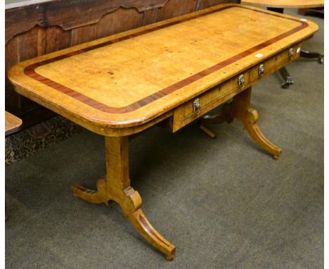 A burr walnut and cross banded sofa table fitted with two drawers, and lion mask drop ring handles 