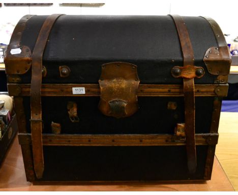 A leather bound dome top trunk 