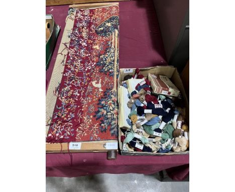 A tapestry frame with part completed tapestry and box of threads