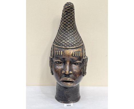 A bronze Benin head. 16¾' high