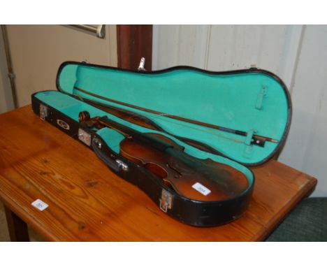 A reproduction Stradivarius violin with carrying case and bow