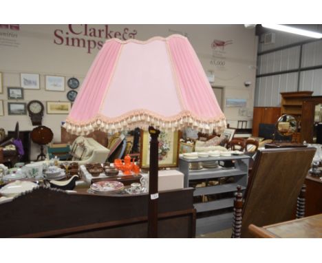 A mahogany standard lamp and shade