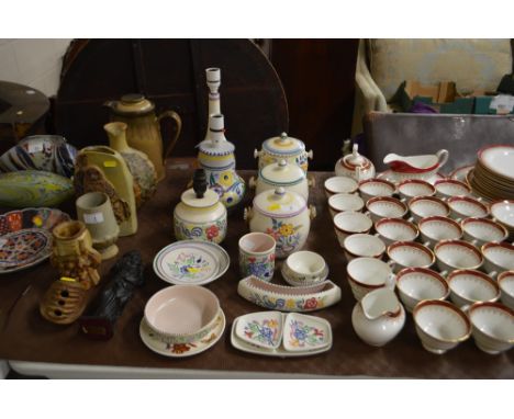 A collection of Poole pottery to include table lamp base and biscuit barrels