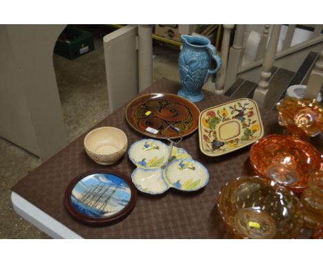 A Poole pottery Aegean plate; a Wade Art Deco jug and an Art Deco hors d'oeuvres dish; a Poole miniature plate depicting a sh
