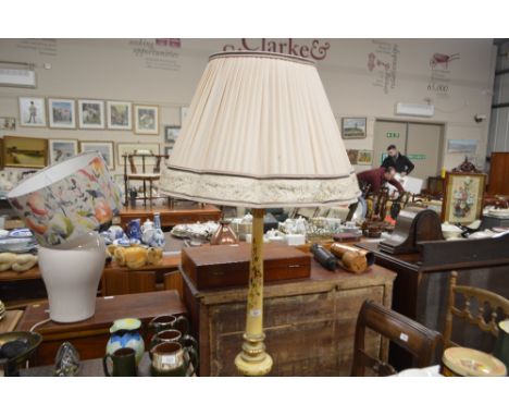 A floral decorated and painted standard lamp and shade