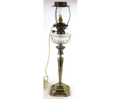 A good quality late 19th century silver-plated oil lamp
Having a cut glass reservoir, raised on octagonal support, height 62c