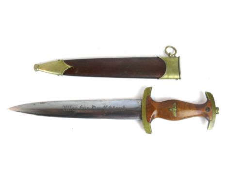 A Nazi Germany S.A. dagger
The 22cm straight double edged blade marked Allesfur Deutschland, maker Anton Wingen Jr Solingen, 