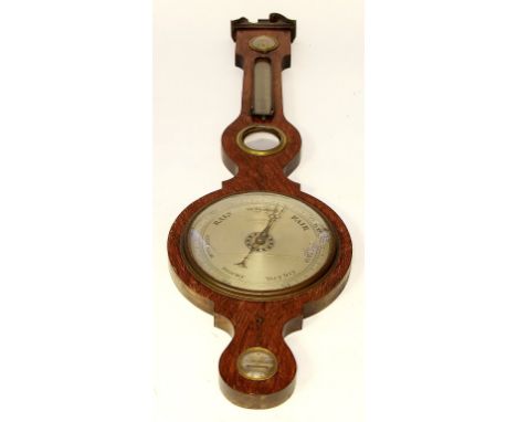 A Georgian mahogany wheel barometer
Length 108cm.
