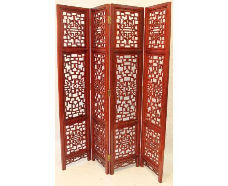 A contemporary Chinese four fold screen
Each of the rectangular panels inserted with pierced shou characters inset within car