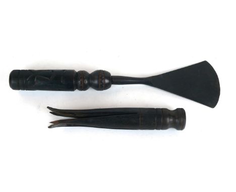 A Fijian wooden cannibal fork, late 19th/early 20th Century
The wooden fork with turned and incised decoration, the fork pron