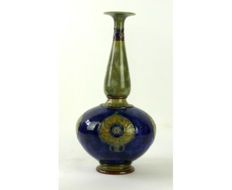 A large Royal Doulton vase of bulbous form with cylindrical neck
Relief decorated with four Art Nouveau roundels on a cobalt 