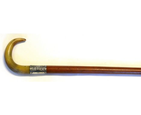 An Edward VII hallmarked silver ferrule walking stick
Having shaped carved bone handle above chased hallmarked silver Ferrule