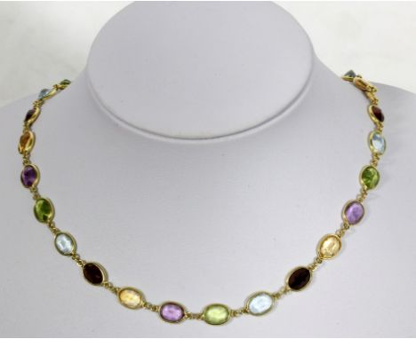 An 18ct yellow gold and multi gem set necklace
Set with thirty-two faceted oval coloured stones, the clasp stamped with indis