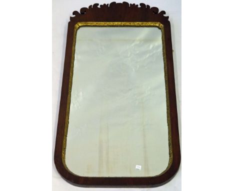 A Chippendale revival mahogany and parcel gilt wall mirror, 19th Century
The stylised foliate crest above shaped plate, appro