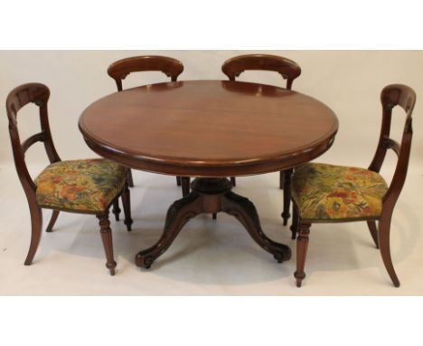 A Victorian mahogany circular tilt top breakfast table and set of four early Victorian mahogany dining chairs
The table with 
