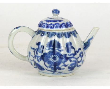 A Chinese blue and white porcelain tea or wine pot, Qianlong period (1735-96) Of lobed globular form, painted in rich cobalt 