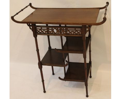 A Chinese huanghuali side table
The scroll pavilion type top with twin turned slender stretchers, the pierced Chinese archite