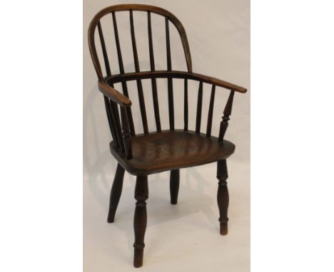 A late Victorian/Edwardian child's elm and beech windsor chair
The comb back above dished seat, raised on turned supports, he