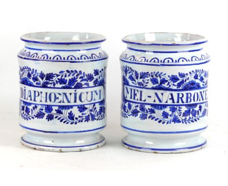 A pair of Italian faience Albarello Drug jars 
Each of waisted form raising from a spreading circular base and extending to a