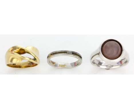 Three Georg Jensen rings
Comprising an 18ct yellow gold ring of contemporary design with open twist form, approx. 9gms, a sil