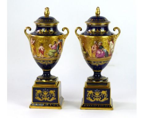 A pair of fine quality Vienna porcelain hand painted and gilt decorated urns and covers
Each decorated with classical myths, 