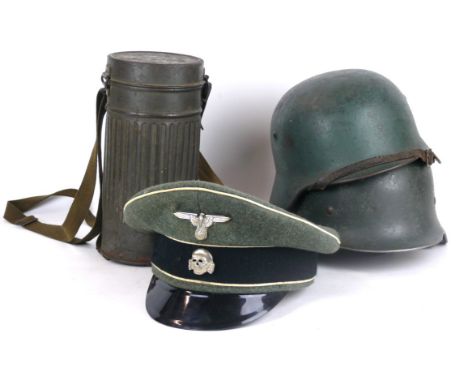 A German Infantry soldier's M 1935 helmet, early to mid 20th Century
The green painted shell with traces of a double decal, w