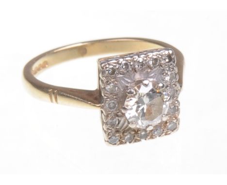 An 18ct yellow gold diamond dress ring
The central principle round cut diamond approximately .75 cts with further smaller rou