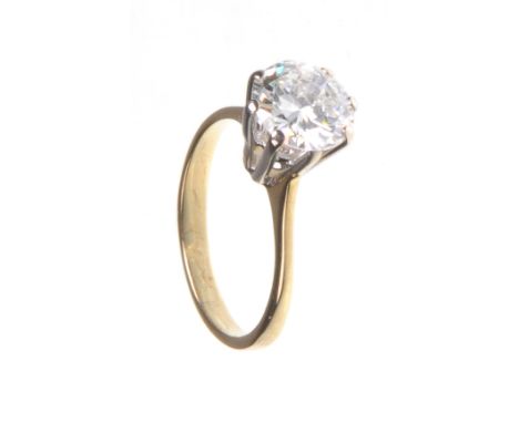 A diamond solitaire ring, approx. 2ct
The round cut diamond high mounted and claw set on an unmarked yellow and white gold mo