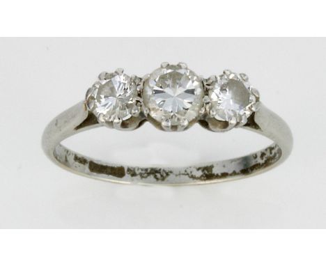 A platinum and diamond three stone ring
The central round cut diamond approx. 0.33cts, flanked by two further round cut diamo