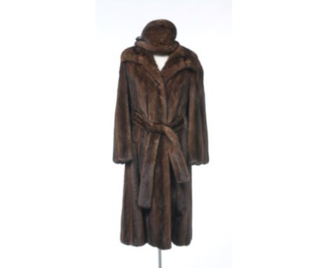 A fine quality ladies Joseph Fox, mink fur coat
The full length belted coat with wide collar and tapered lapel, with full len