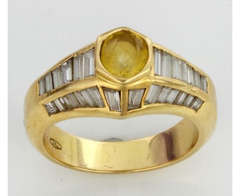 A yellow diamond and white diamond cocktail ring
The central yellow diamond approx. 0.5ct, flanked by three rows of graduated