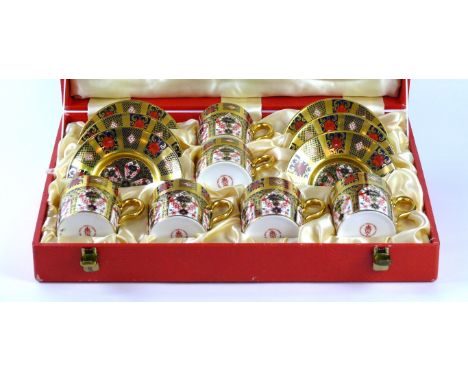 A Royal Crown Derby coffee service decorated in pattern number 1128
Comprising six cans, six saucers, printed factory marks t