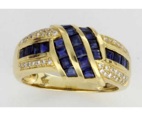 An 18ct yellow gold diamond and sapphire dress ring
Set with twenty-two square cut sapphires and forty-four small round cut d