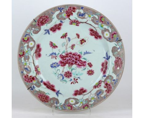 A Chinese famille rose export porcelain charger, 18th Century 
Of circular form, the central white glazed field, painted in r