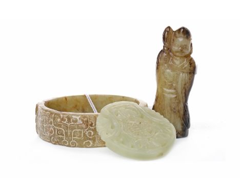 20TH CENTURY CHINESE HARDSTONE BANGLE with geometric designs overall, 8cm diameter; along with a pierced hardstone circular d