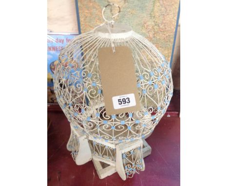A decorative vintage wood and wire bird cage