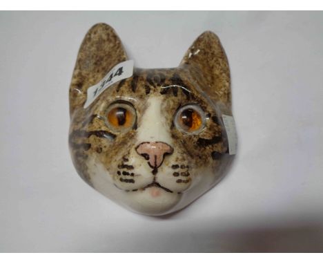 A Winstanley pottery wall mask, depicting a tabby cat's face with inset glass eyes