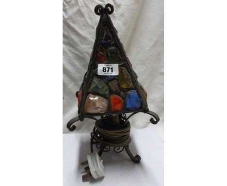 A mid 20th Century Peter Marsh wrought iron table lamp with a multicoloured glass block shade