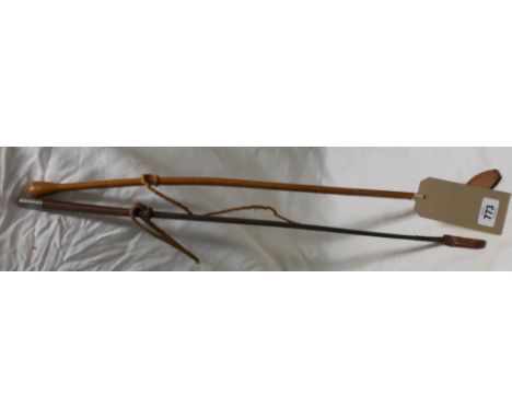 Two vintage riding crops, one a light full leather, the other darker brown with plastic wrap shaft