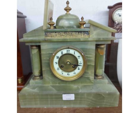 A late Victorian green onyx cased mantel clock of architectural design with Mougin eight day gong striking movement