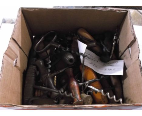 A box containing an assortment of vintage corkscrews