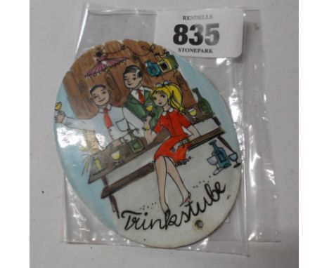 A vintage enamel plaque with hand painted design, depicting revellers with applied sticker to the back 'Steinbock Email handm