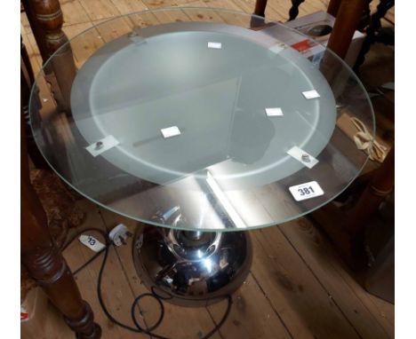 An Arft Deco style chrome plated framed side table with illumination and glass top, set on a tapered pillar
