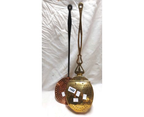 An antique brass chestnut roaster of oval form with pierced lift-up lid and pierced handle - sold with a copper skimmer with 