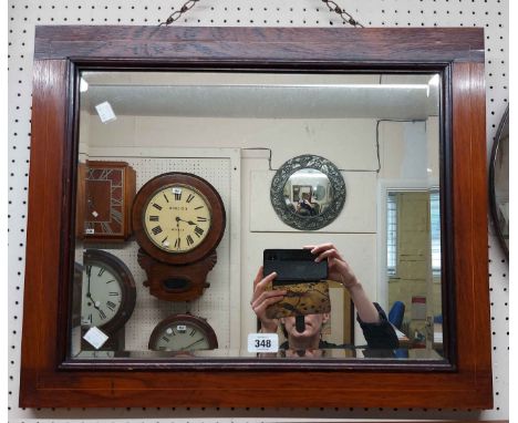 An Edwardian rosewood and strung framed bevelled oblong wall mirror - sold with a vintage frameless circular wall mirror with
